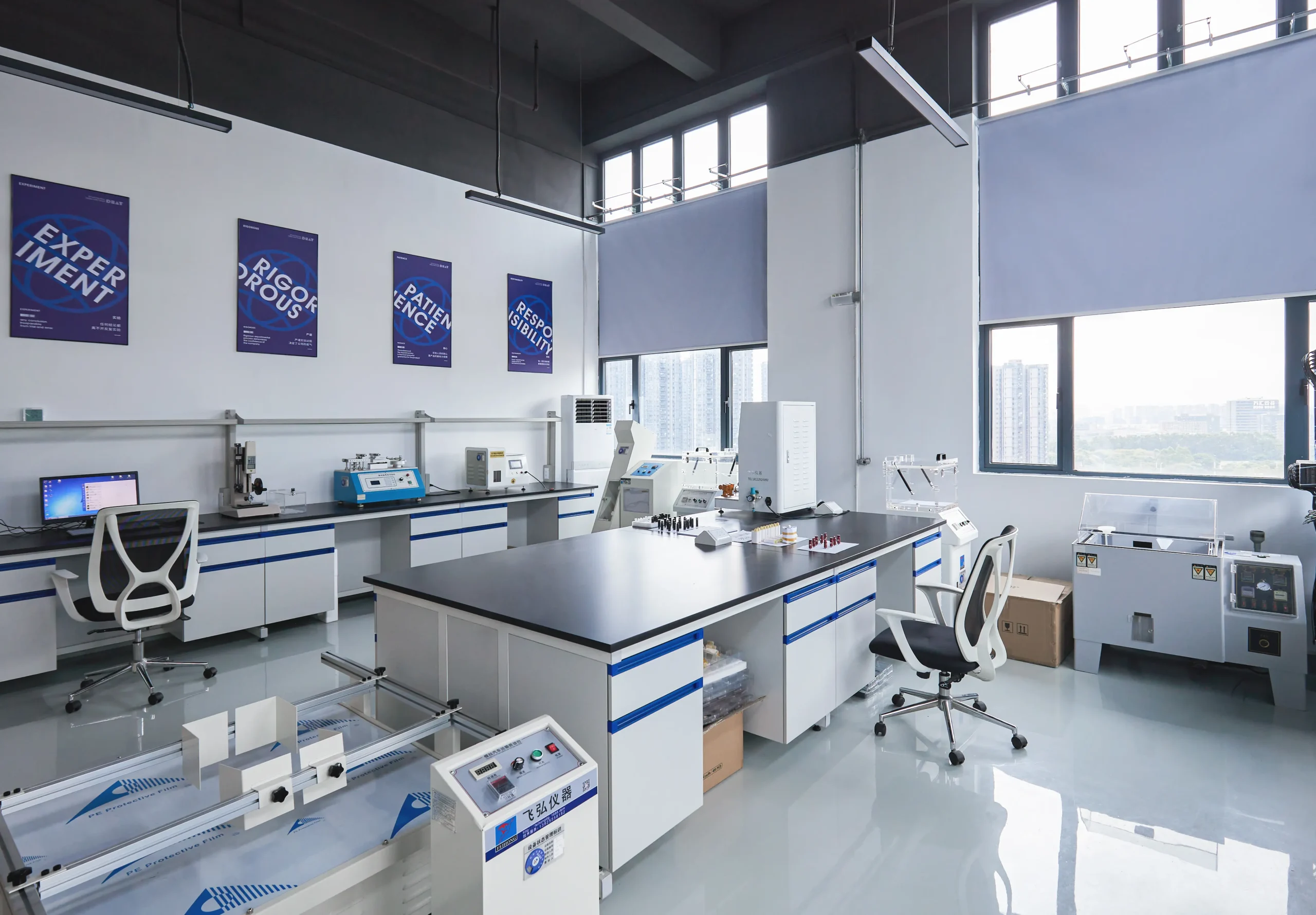 Vape ODM Factory R&D and materials testing laboratory with brand value posters and professional testing equipment in Dongguan